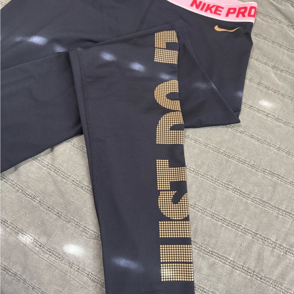 Women’s Nike Black Leggings with Gold Accents - Picture 1 of 4